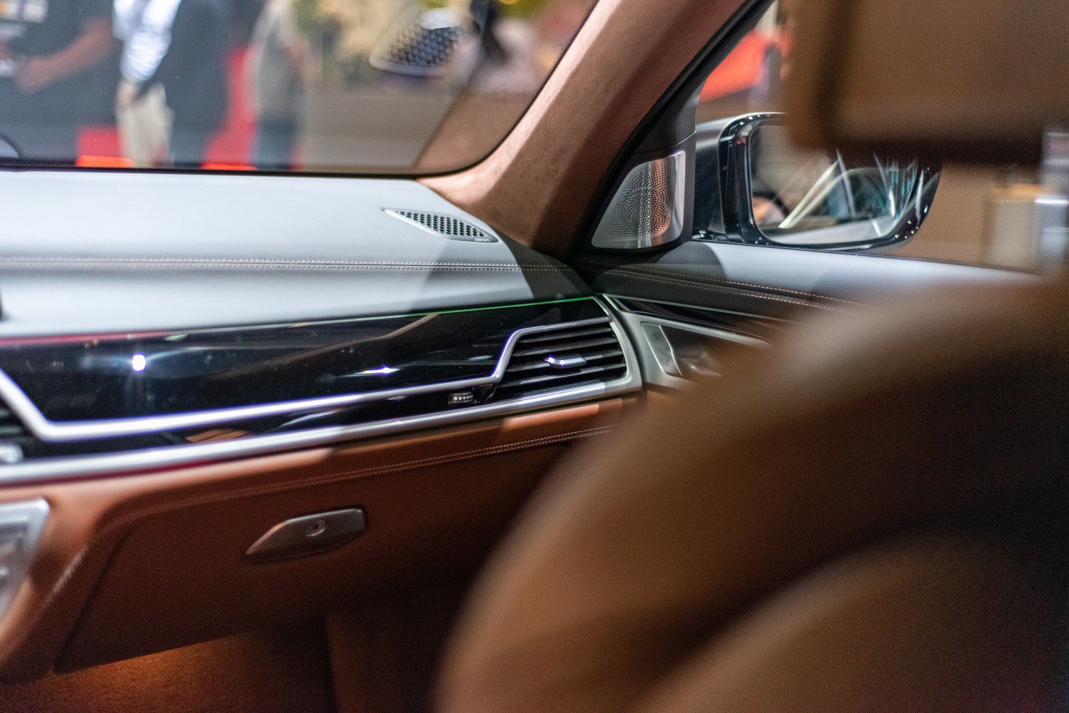 Sleek dashboard and door panel with premium materials and air vent detail
