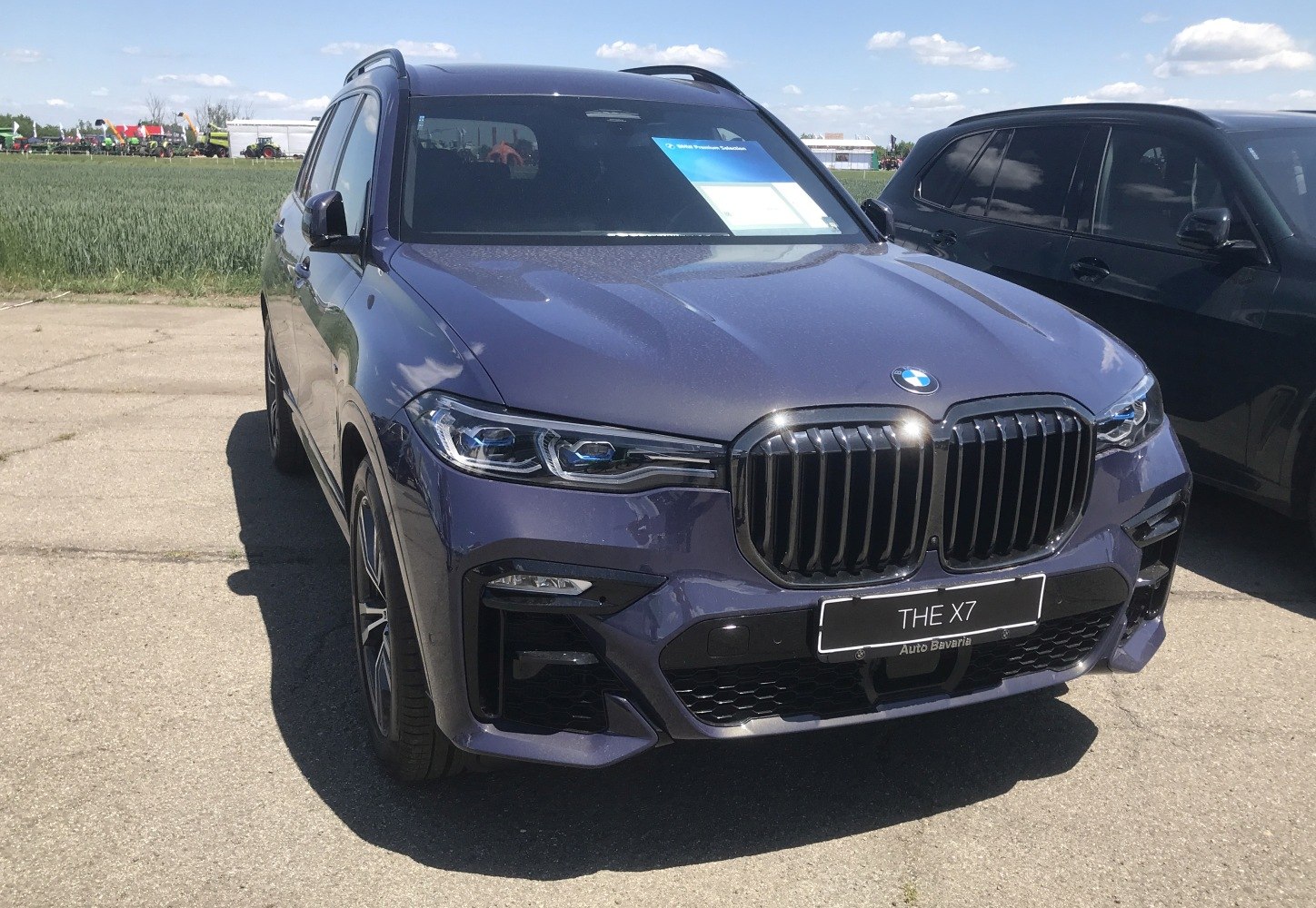 Large kidney grille and LED headlights on luxury SUV front.