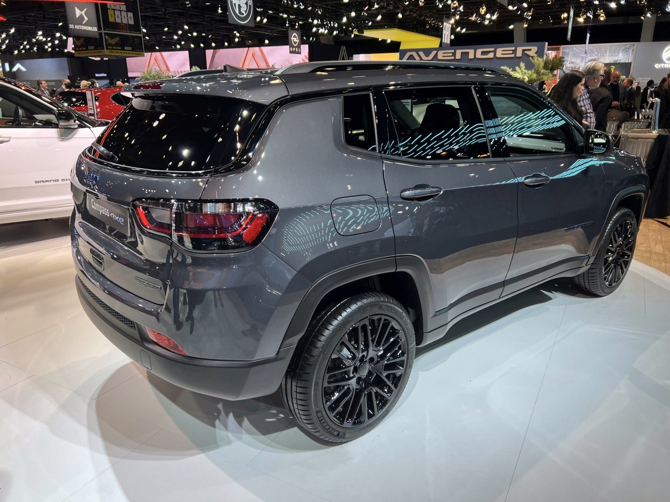 Rear and side view of an SUV with black alloy wheels and sleek modern design.