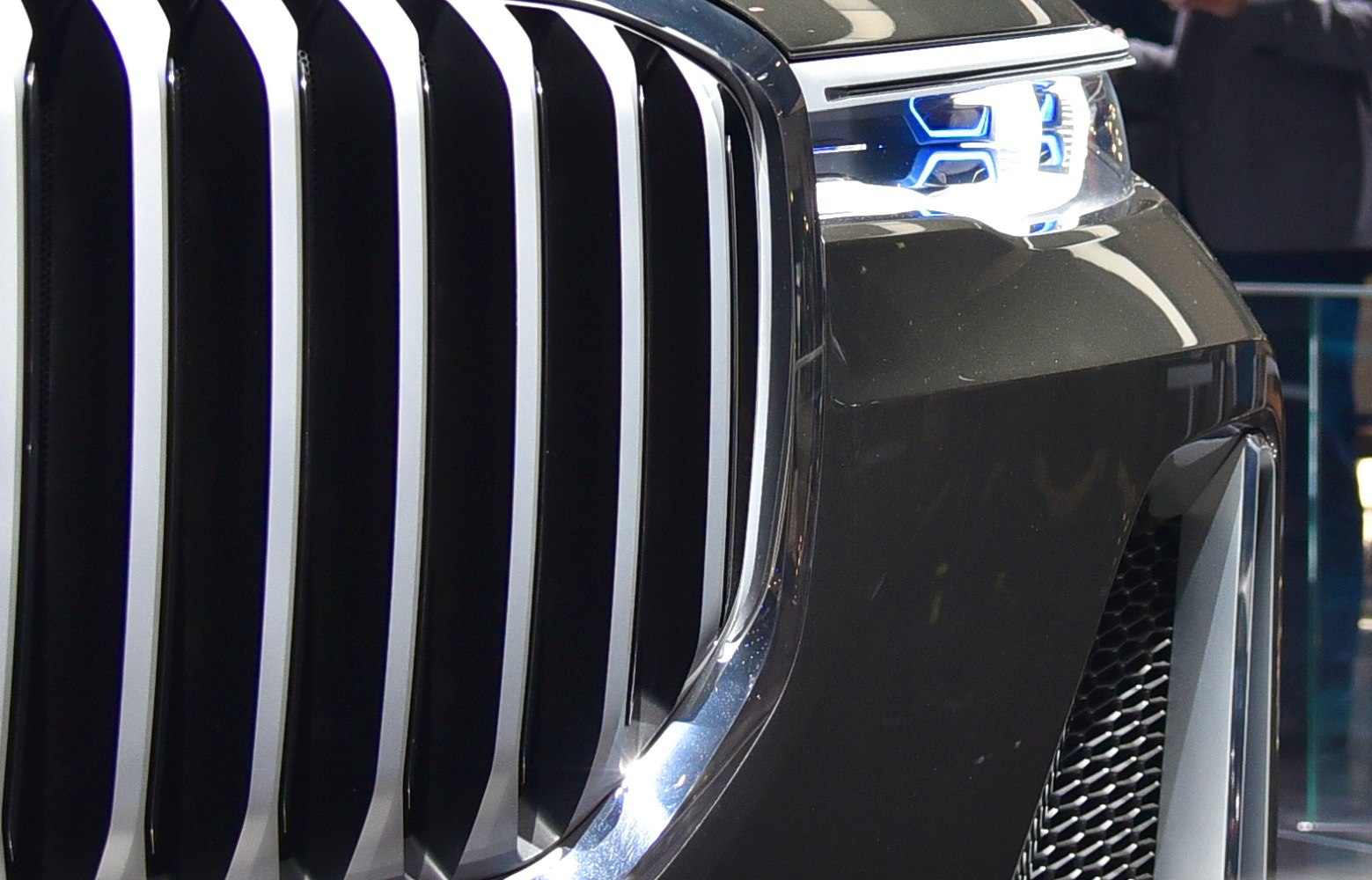 Close-up of vertical kidney grille and futuristic LED headlight