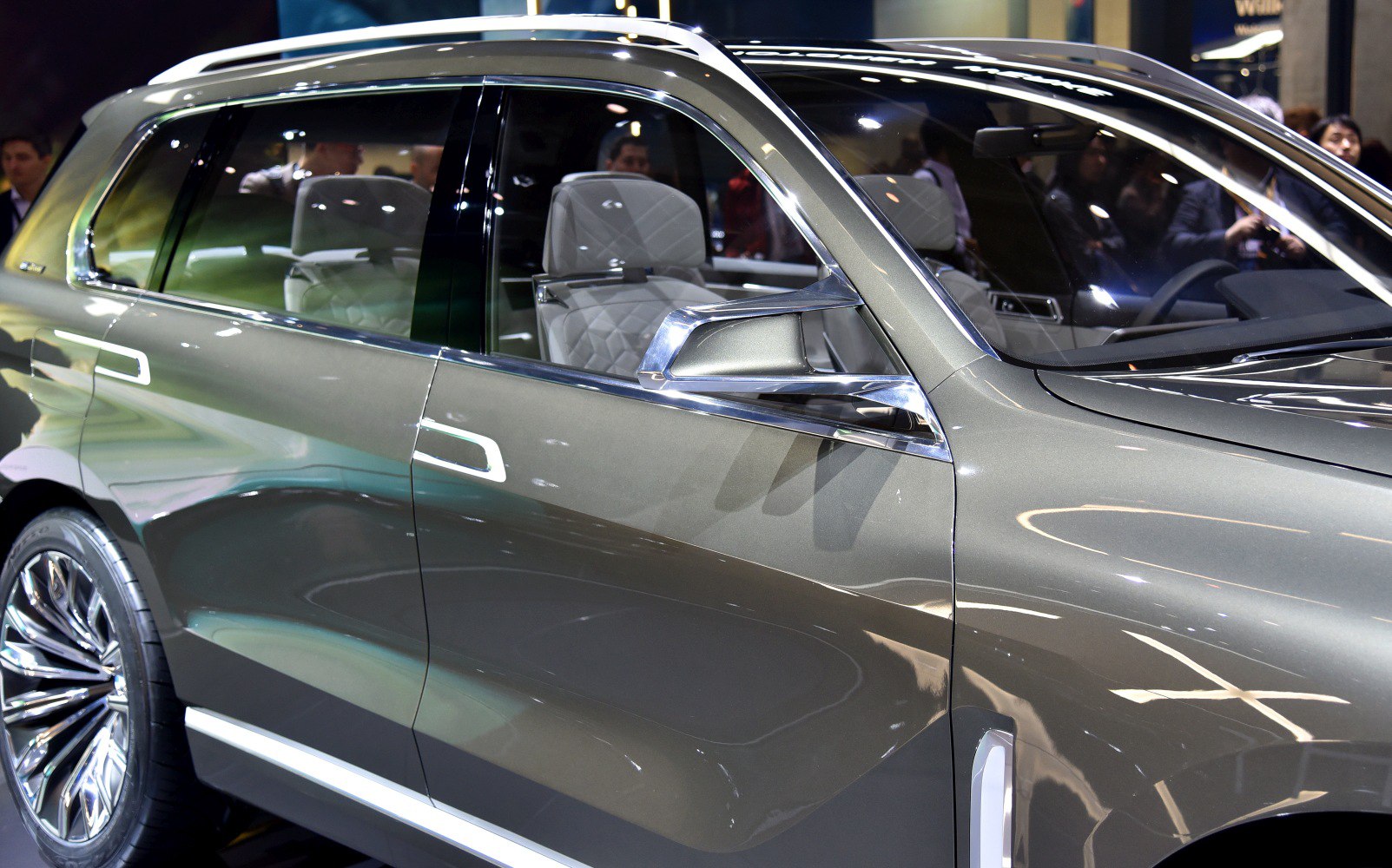 Silver side profile with chrome trim and quilted white interior seats