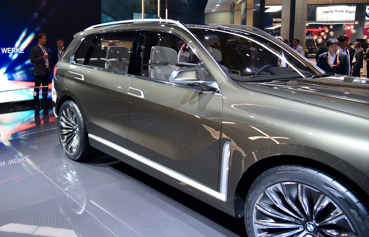 Side profile with large alloy wheels and quilted leather interior seats.