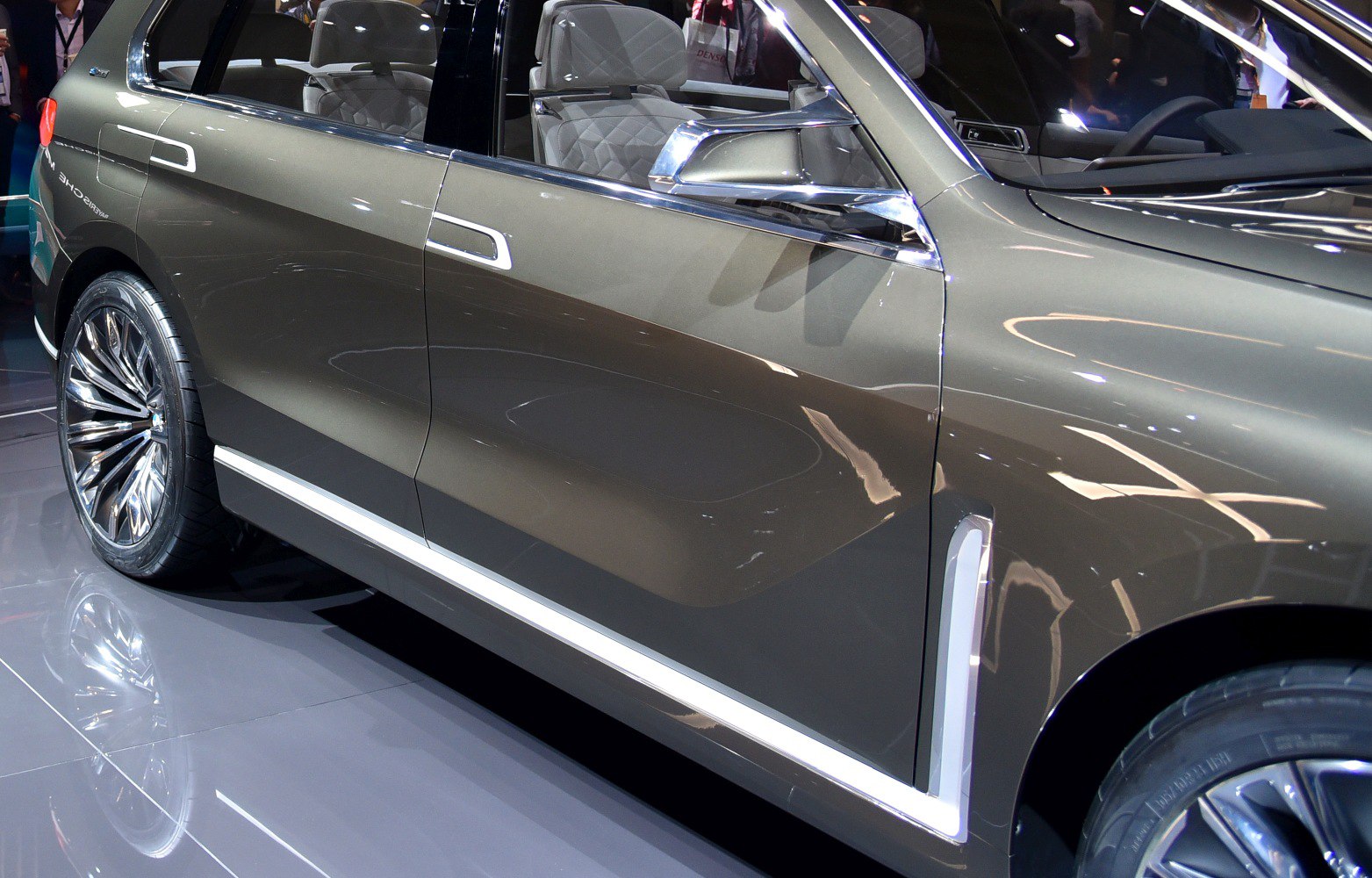 Side profile with door design, side mirror, and wheel.