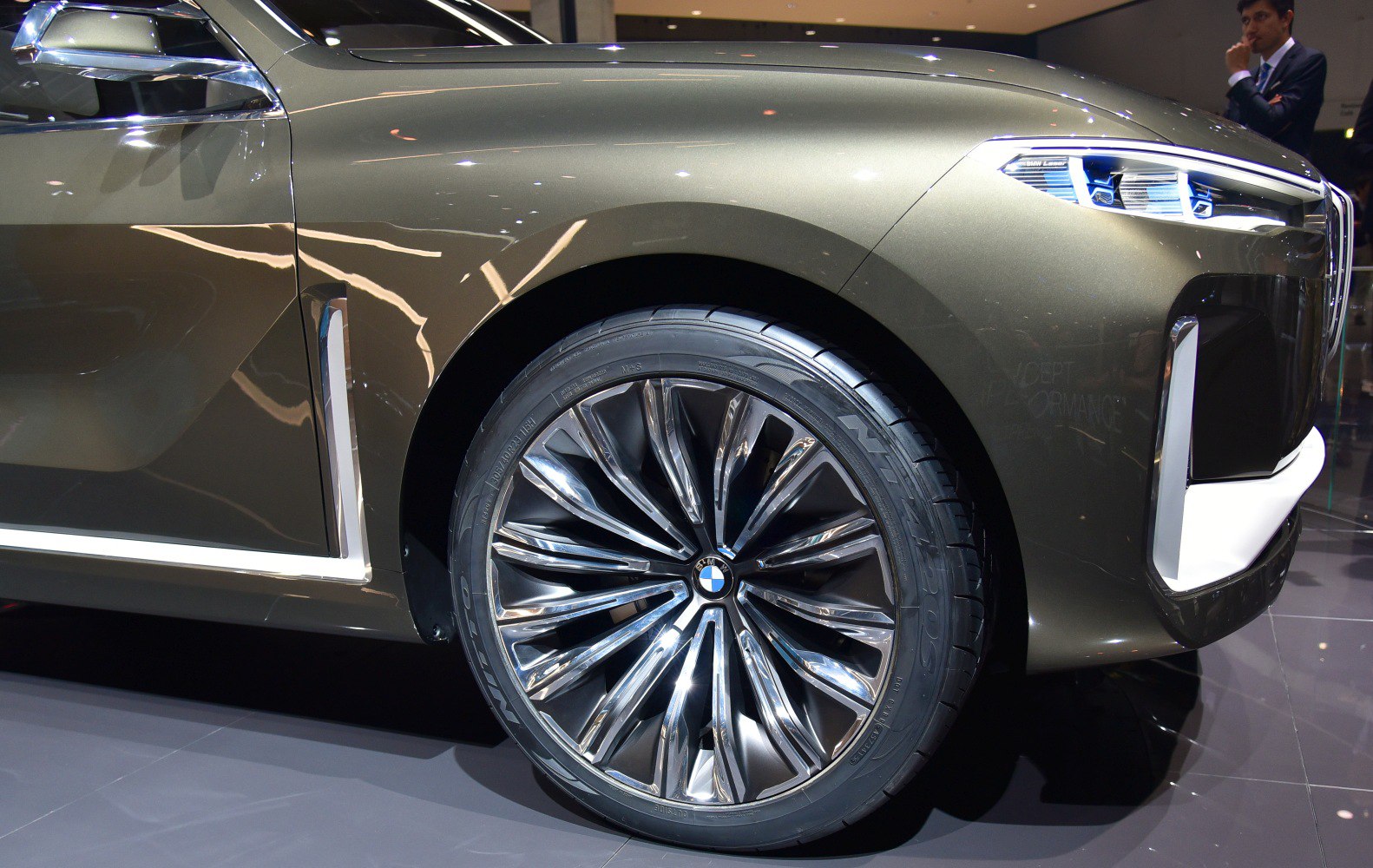 Futuristic alloy wheel and LED headlight design detail