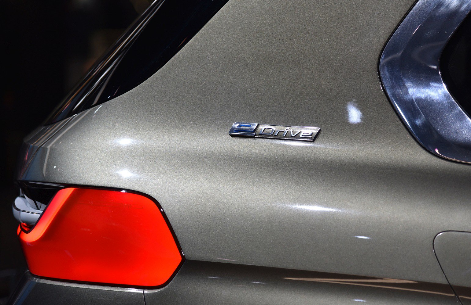 Close-up of eDrive badge and bright red rear tail light