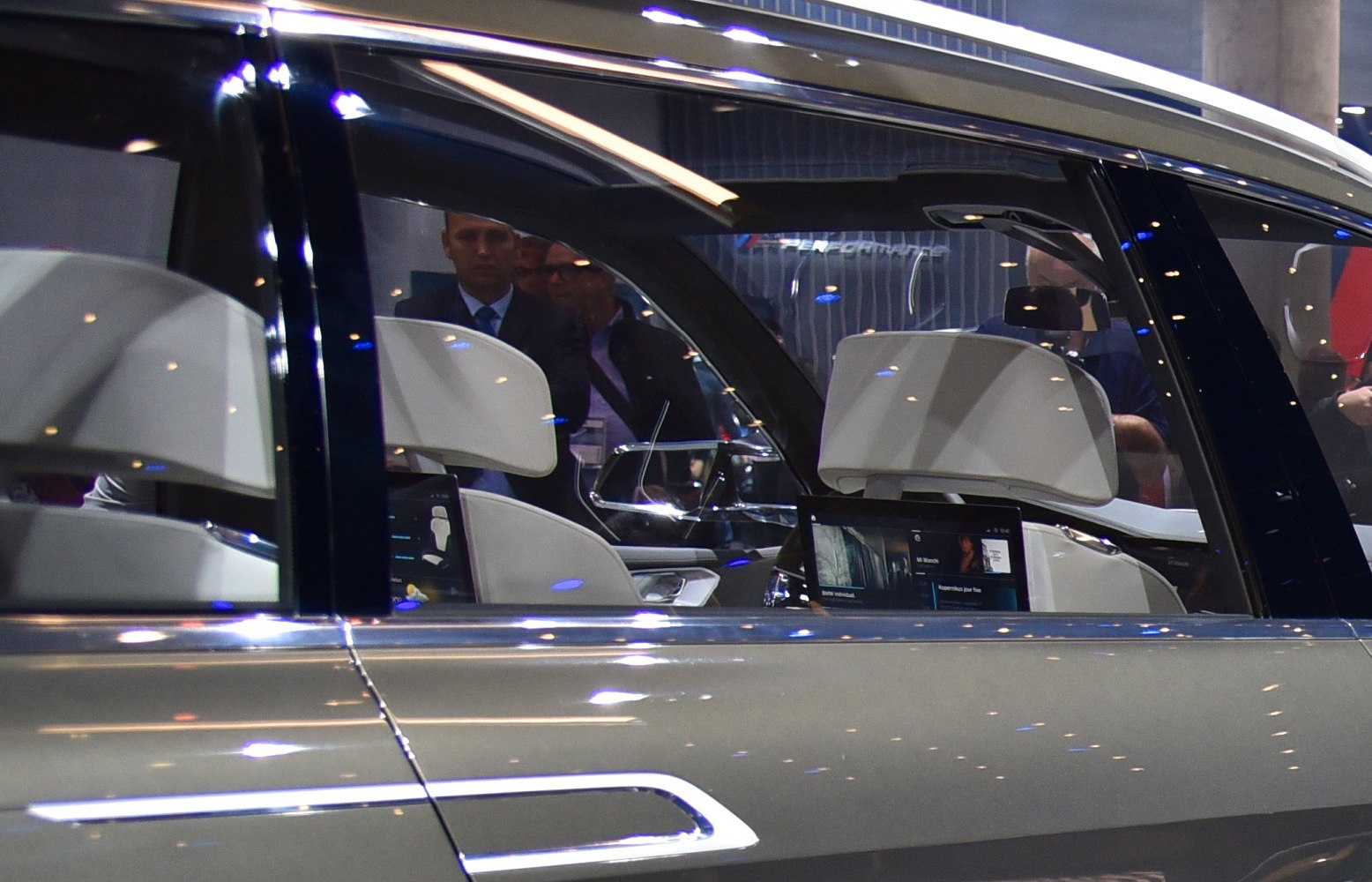 Luxury white seats with dual rear entertainment screens