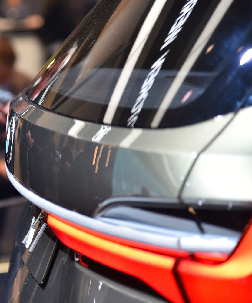 Close-up of rear tinted window and illuminated taillight strip.