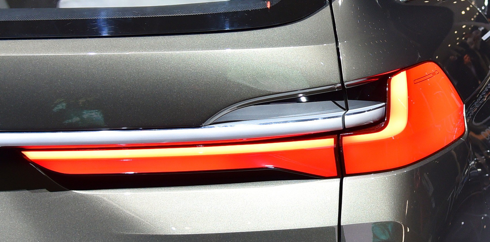 Rear LED tail light with intricate modern design and sharp angles