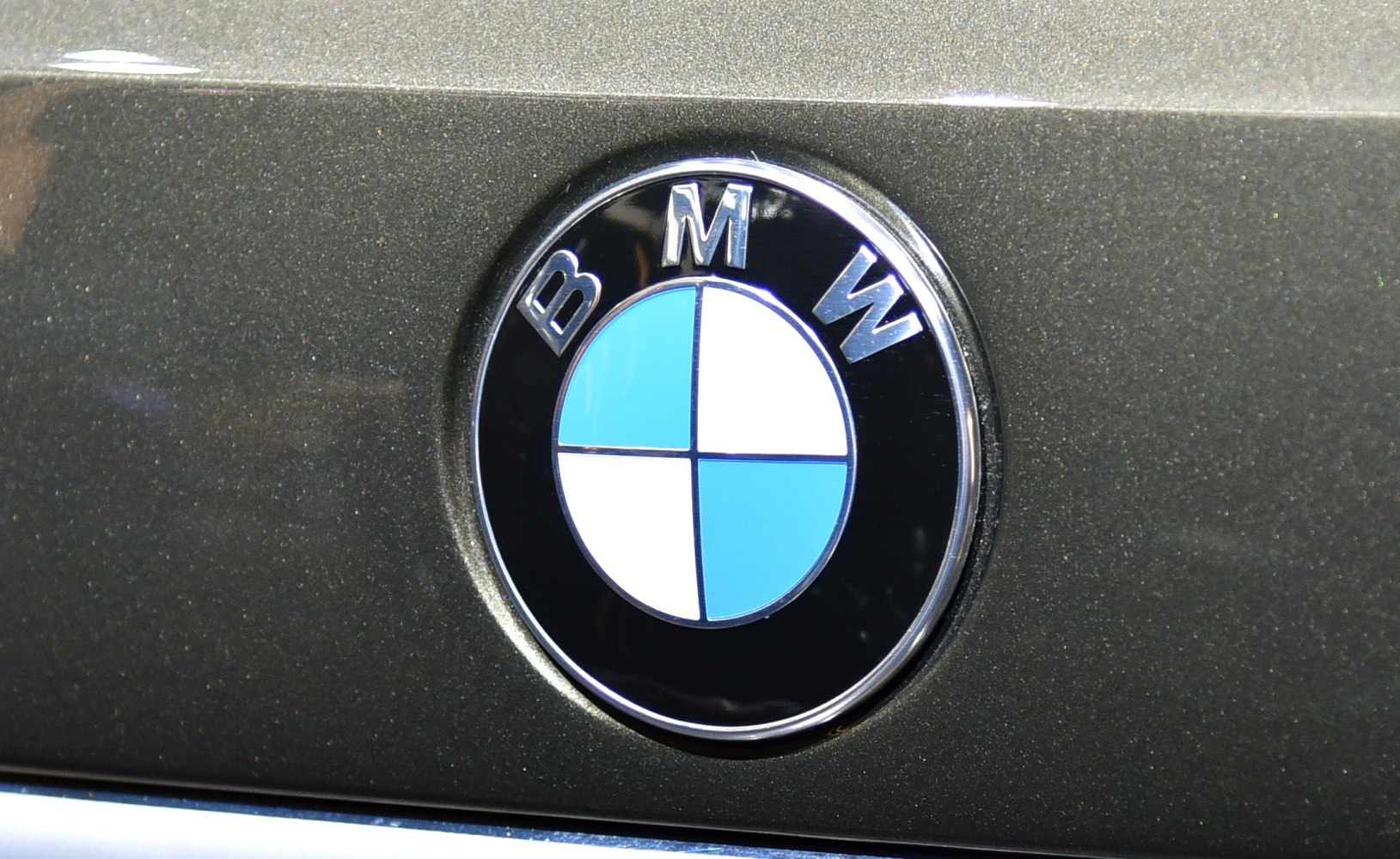 Close-up of BMW roundel emblem on metallic surface