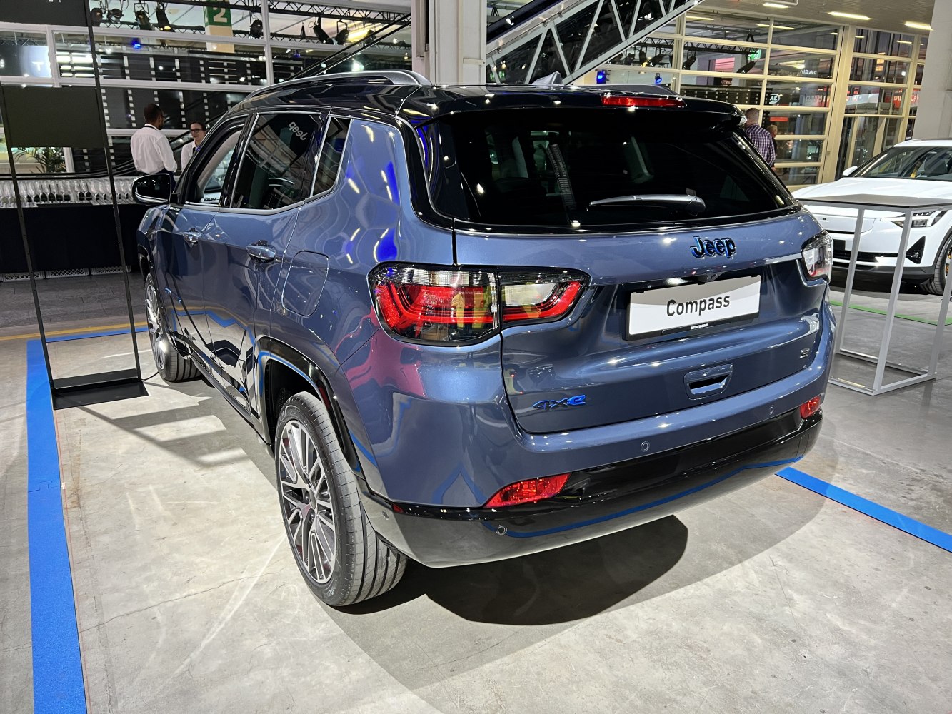 Sleek rear design with distinctive rear lights and black roof accents