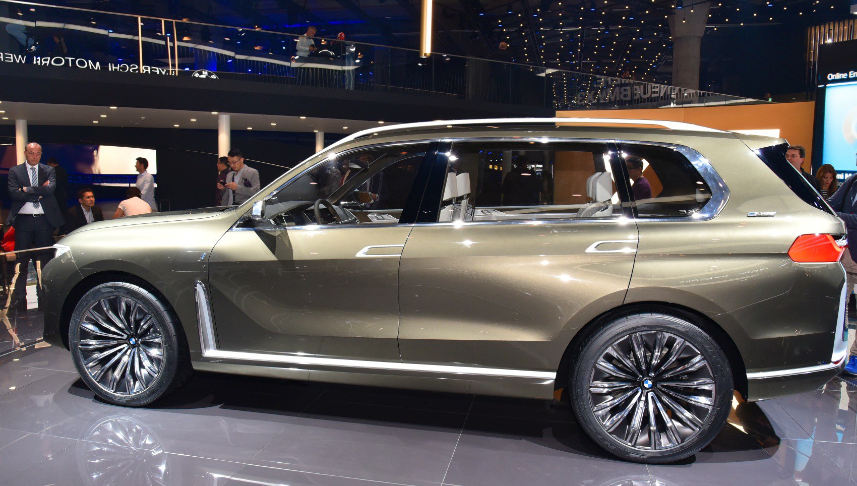 Side profile view of a luxury SUV with large alloy wheels and sleek design