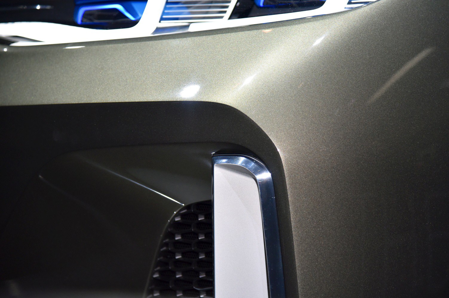 Close-up of front grille and chrome-trimmed bumper detail