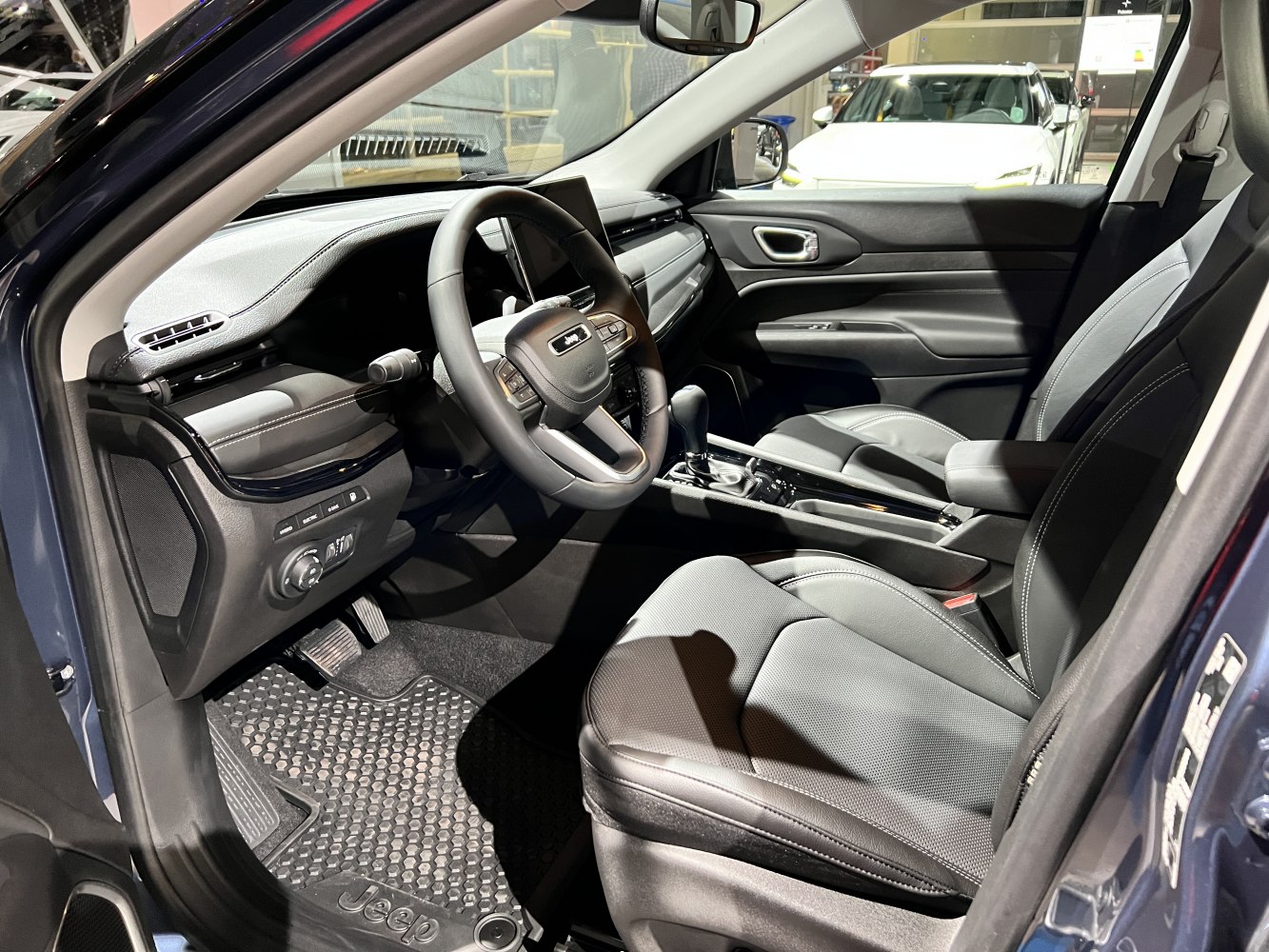 Modern SUV interior with advanced dashboard and multifunction steering wheel