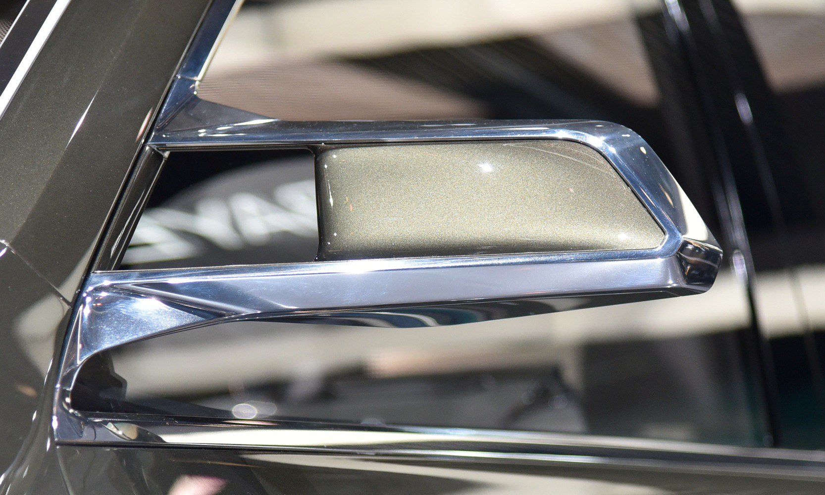 Futuristic side mirror with sleek chrome details