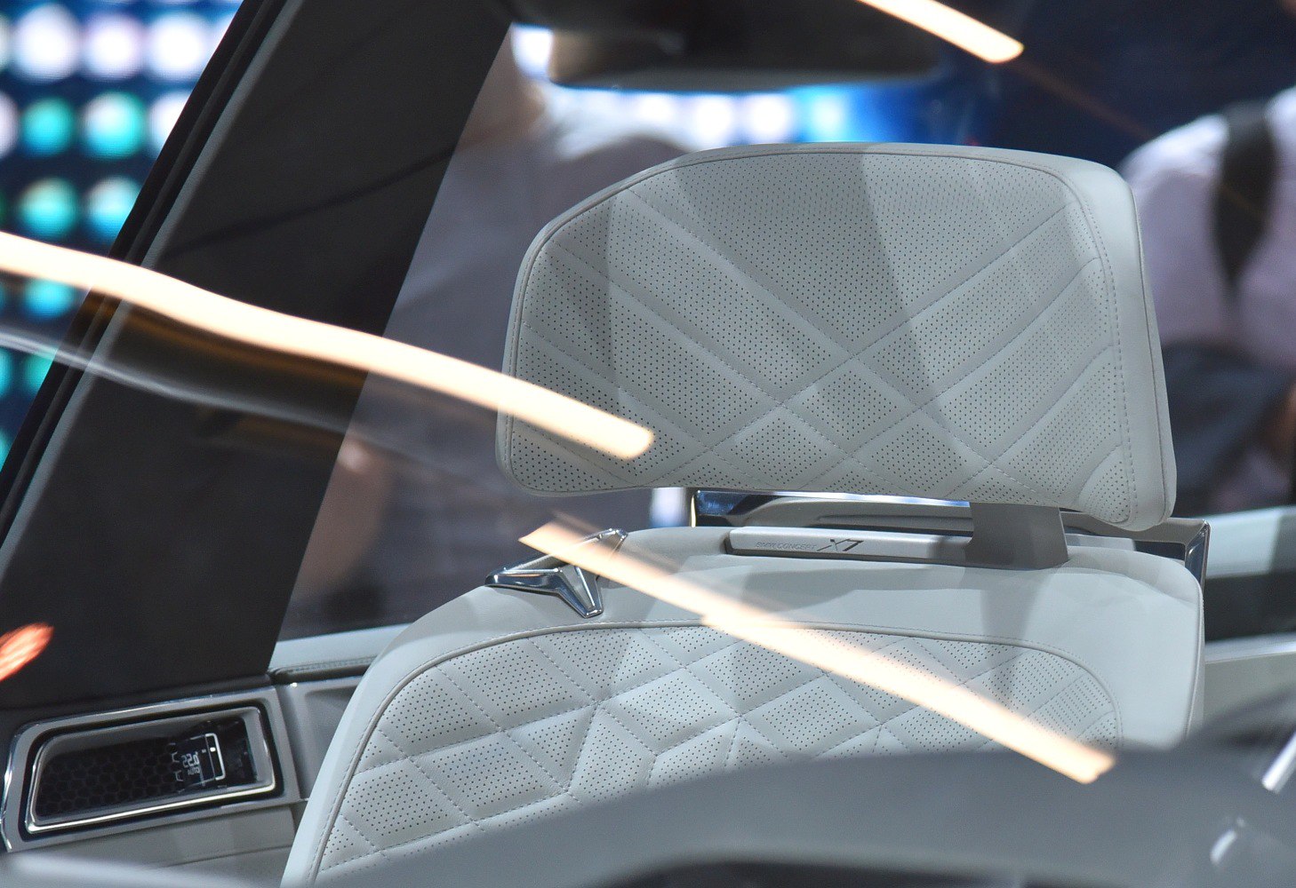 Quilted luxury leather car seat with detailed stitching and comfort features