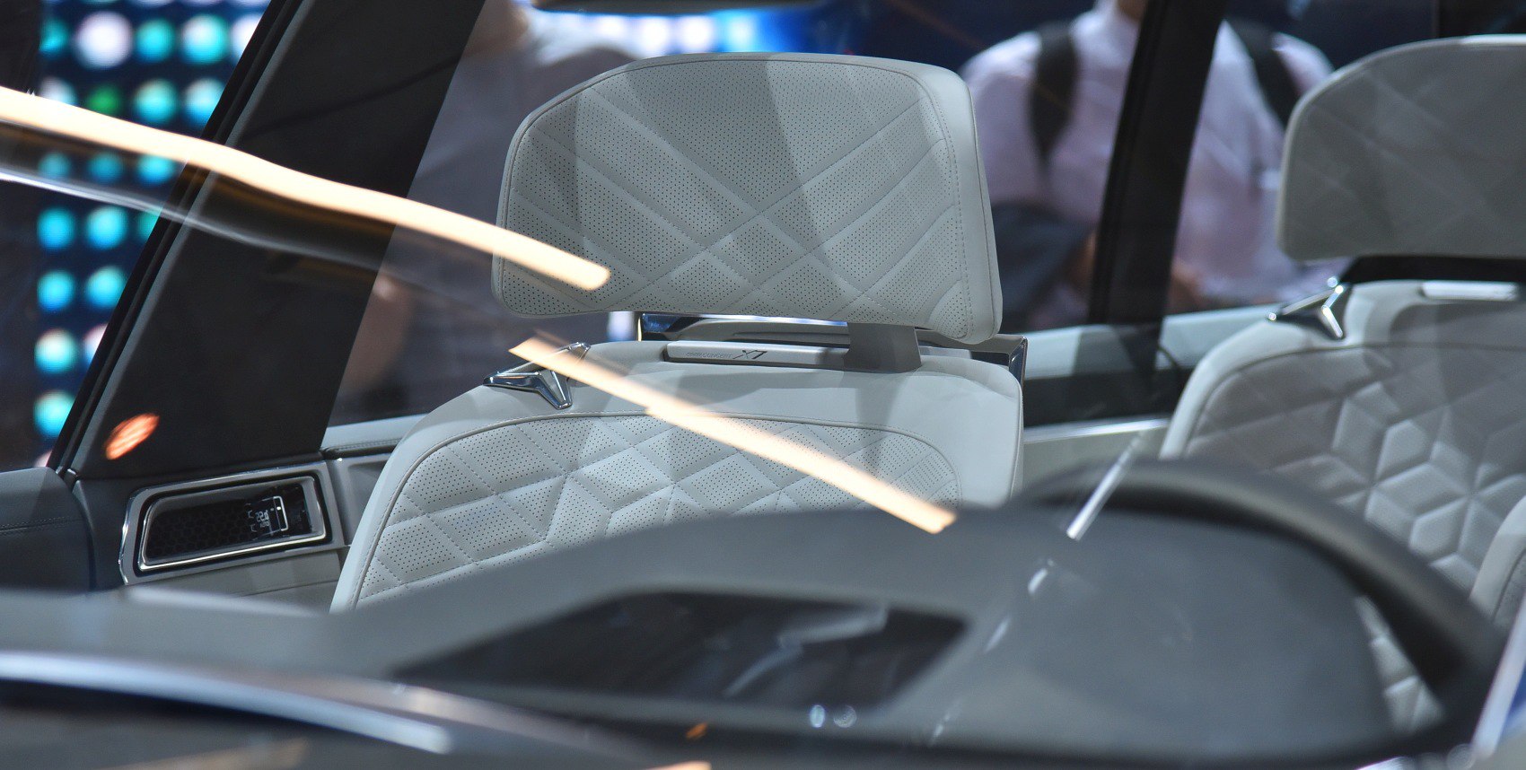 Luxury perforated leather car seats with detailed stitching and headrests