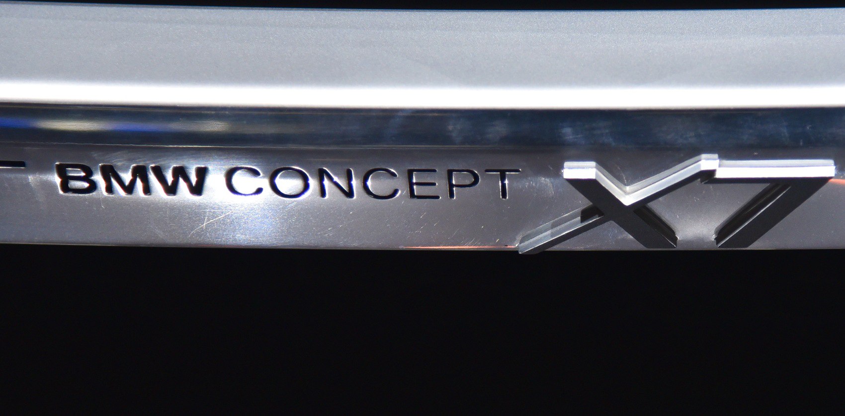 Close-up of BMW X7 Concept metallic emblem lettering