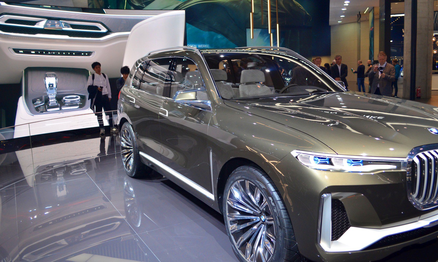Front side view with LED headlights and large alloy wheels.