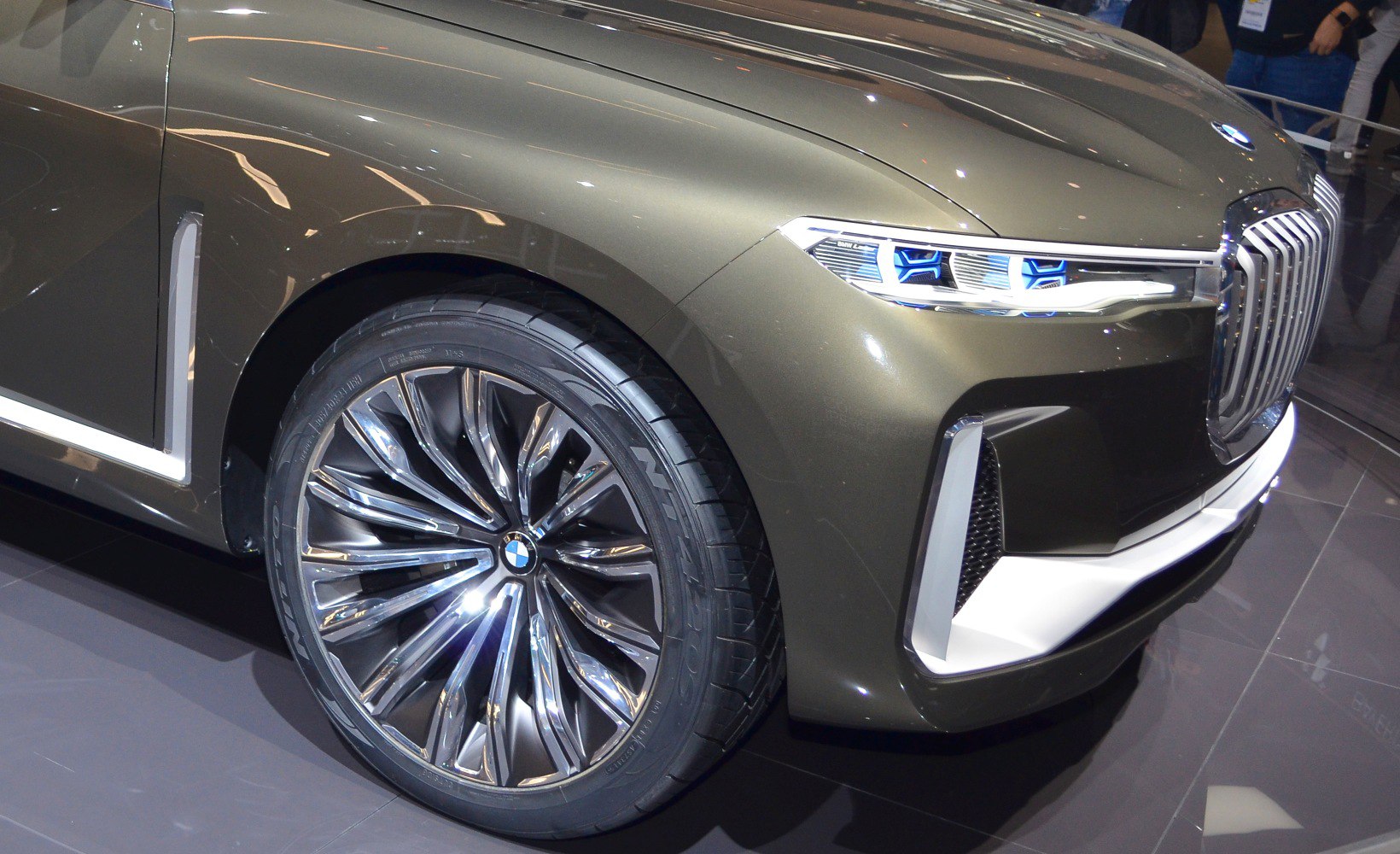 Front wheel with alloy rim and LED headlight with grille section