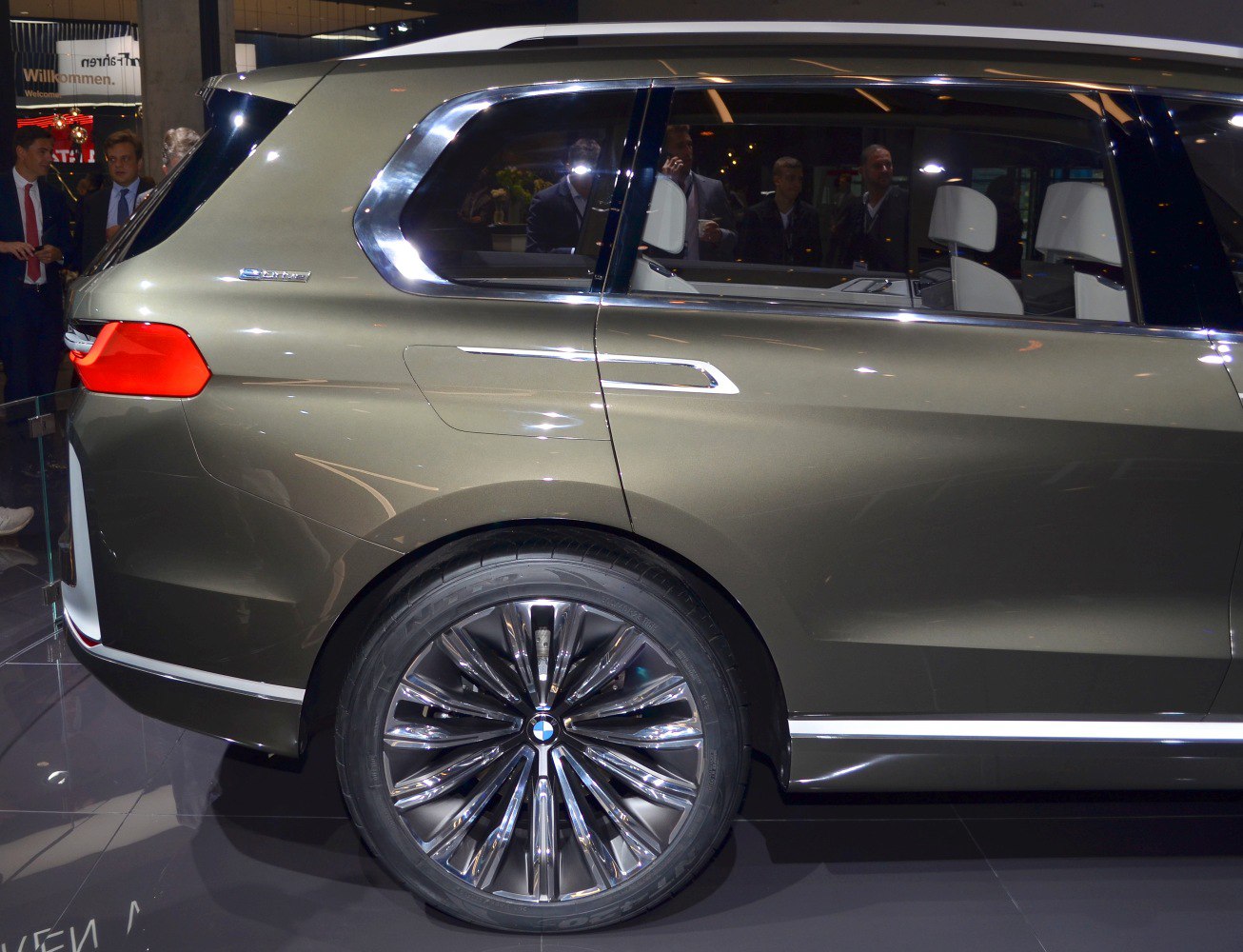 Rear side panel and large multi-spoke alloy wheel close-up