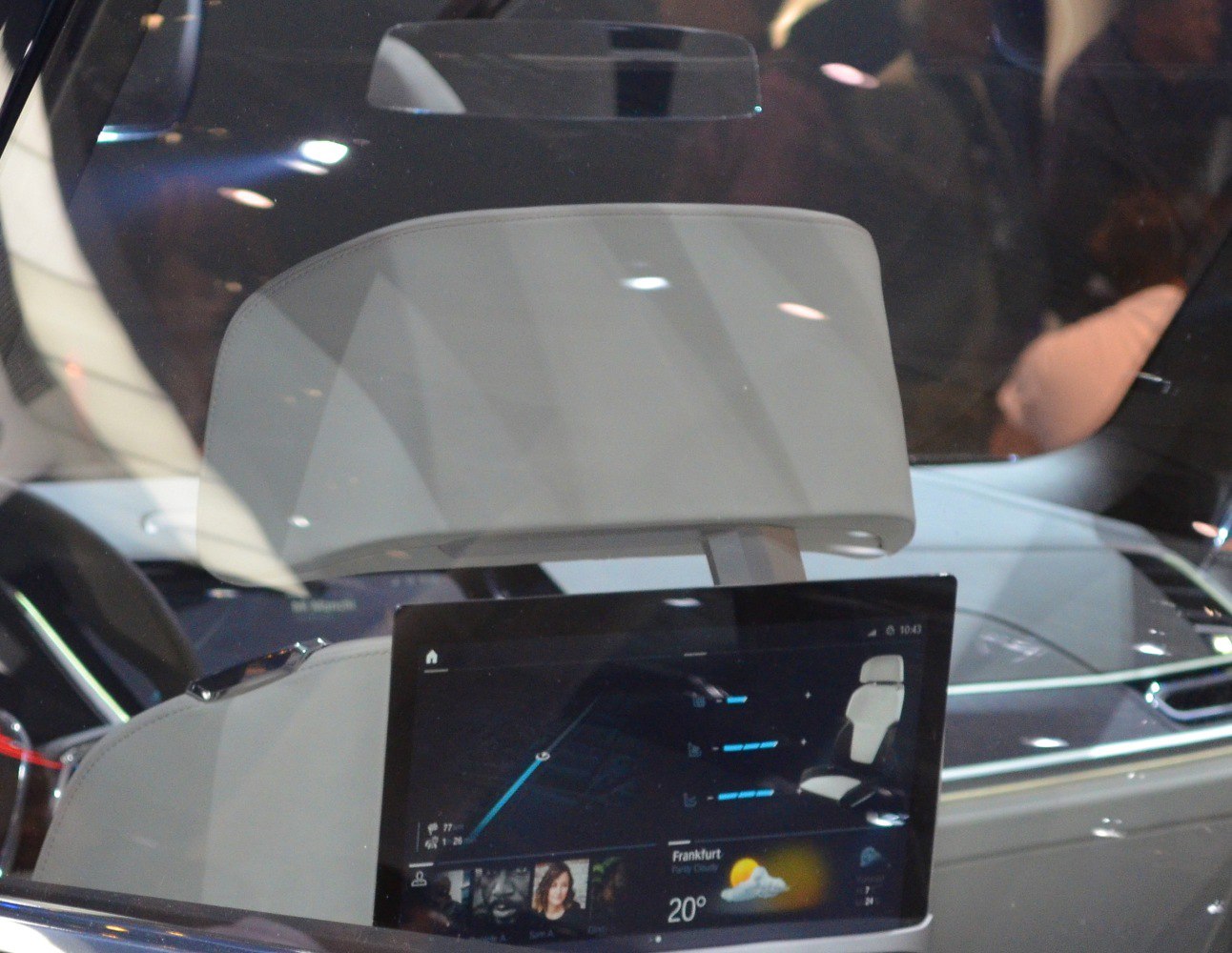 Rear passenger touchscreen display with luxury headrest inside vehicle