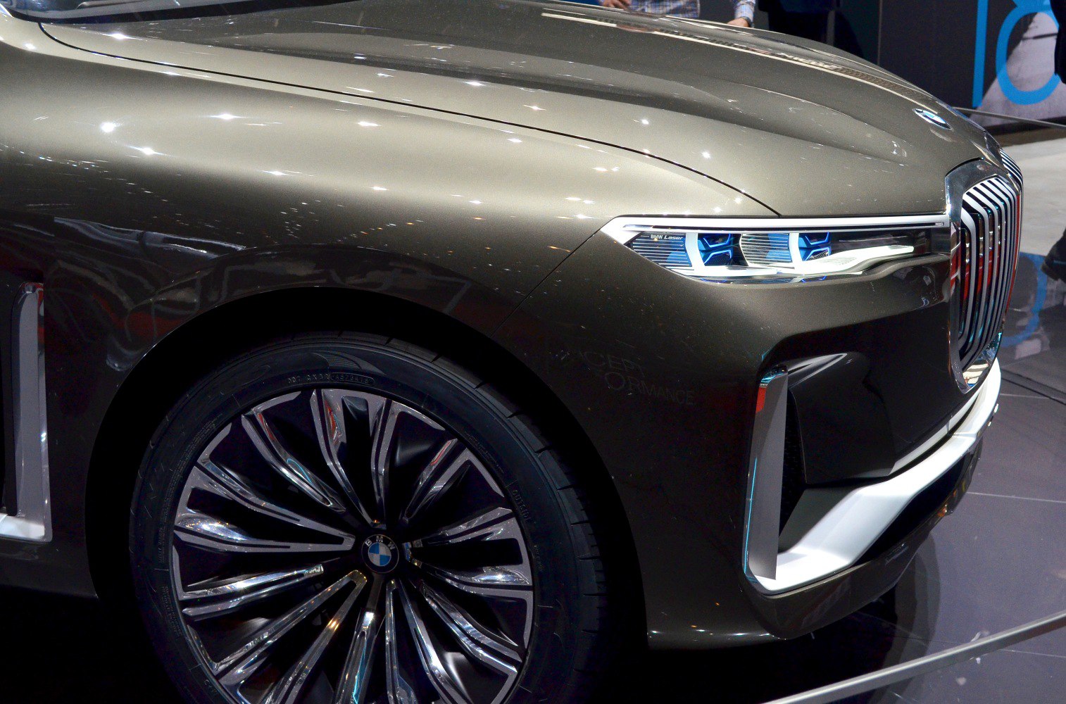 Close-up of luxury alloy wheel and distinctive laser headlights