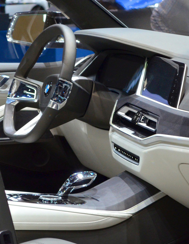 Luxury SUV interior with modern steering wheel and digital dashboard