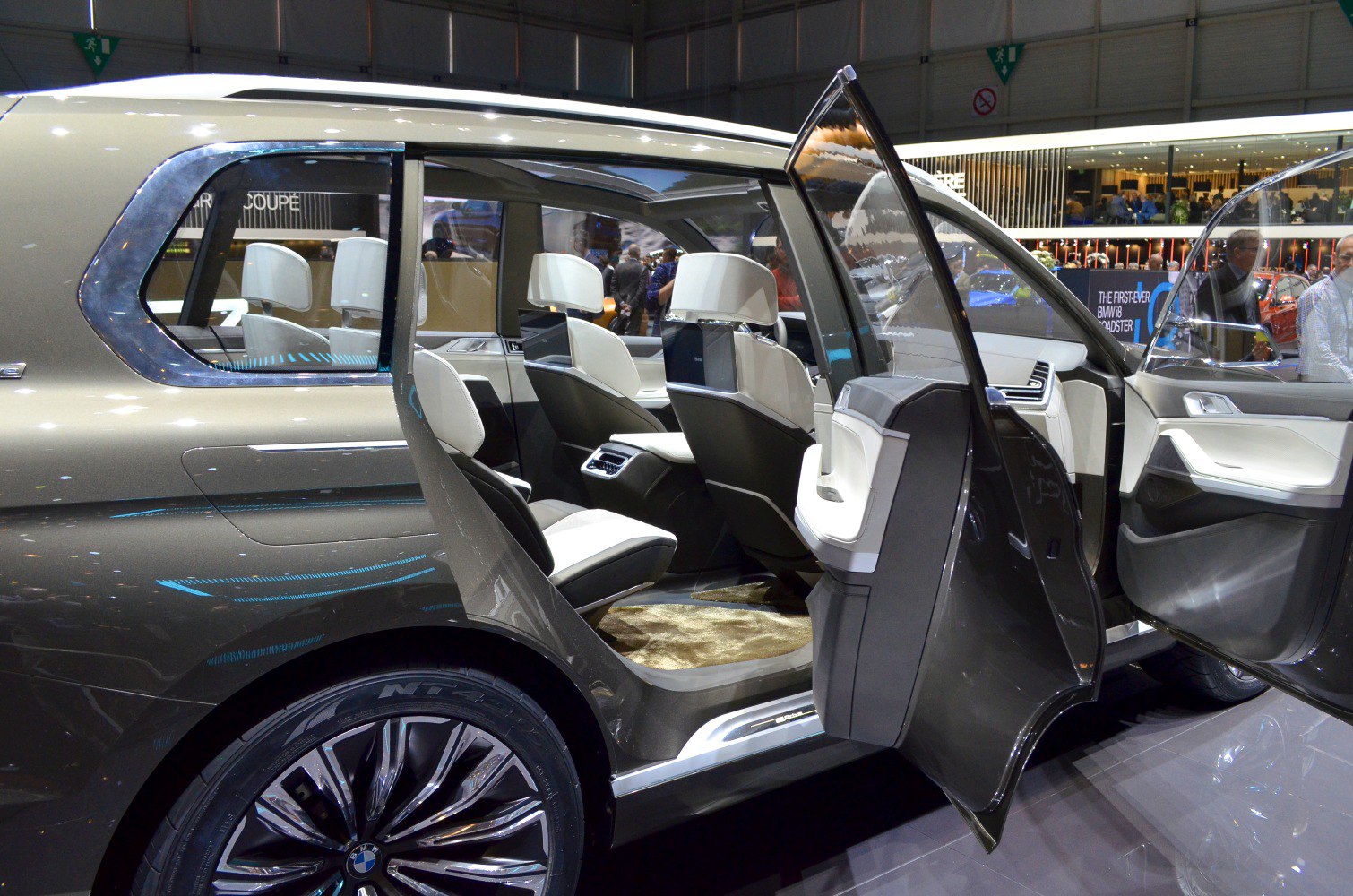 Luxury SUV interior with rear door open and modern seating