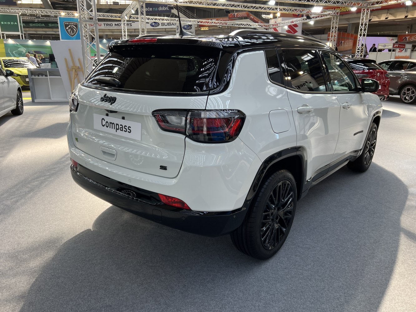 Rear and side profile with black alloy wheels and modern taillights