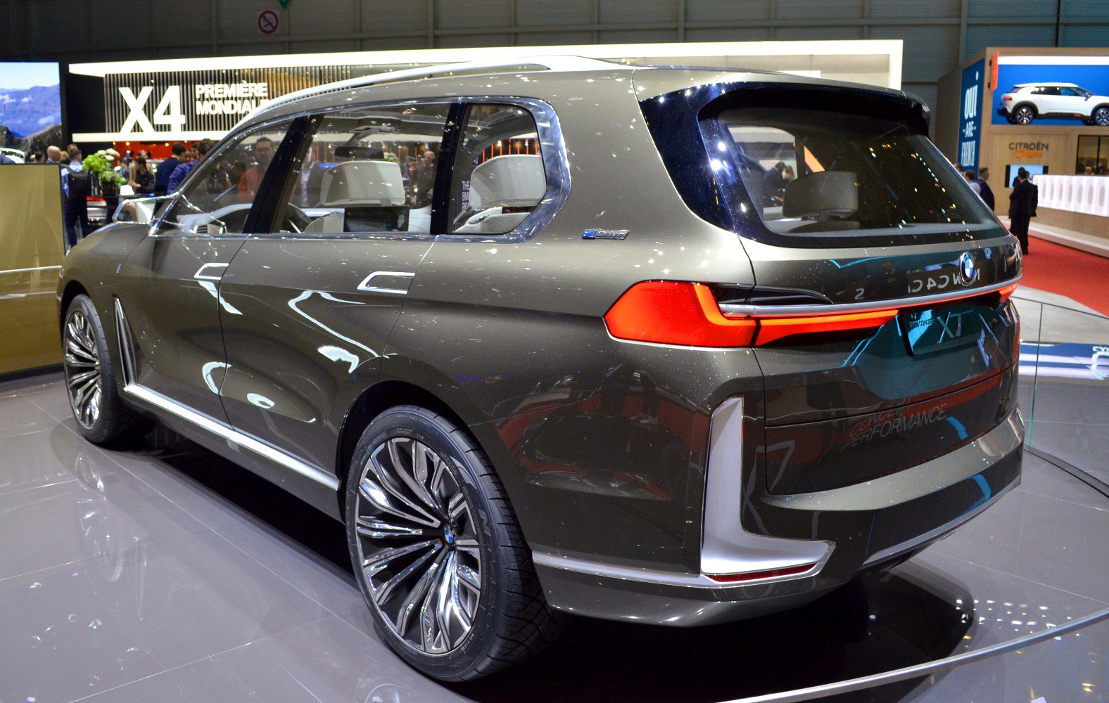 Rear and side view of futuristic SUV with distinctive taillights and large wheels