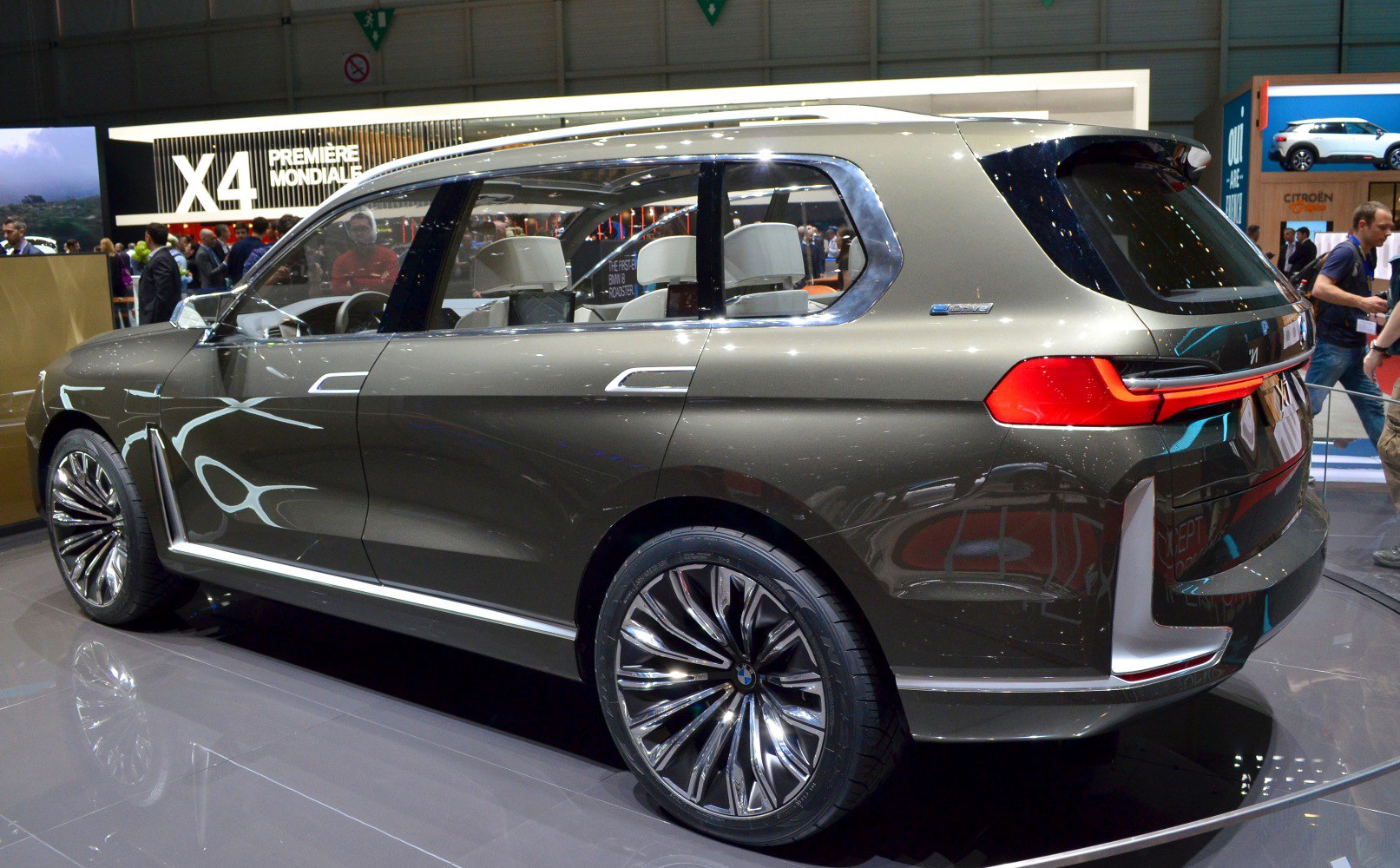 Rear and side view of luxury SUV with large alloy wheels