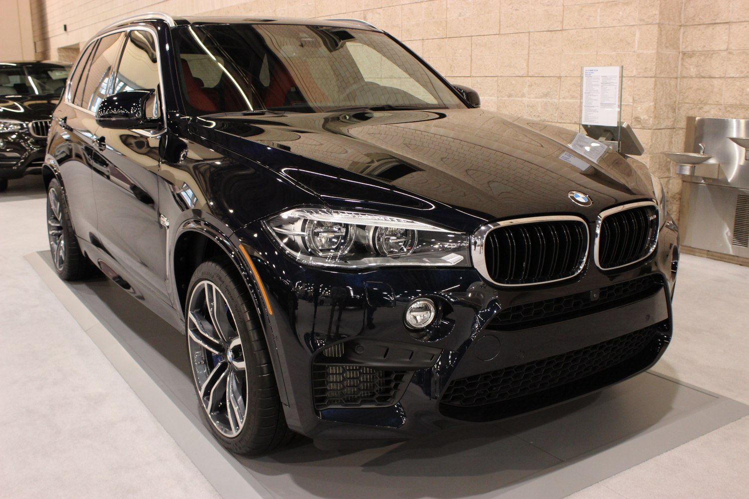 Front angled view with LED headlights and alloy wheels