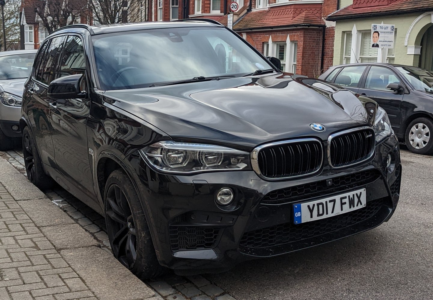 Black SUV front view with kidney grille and LED headlights