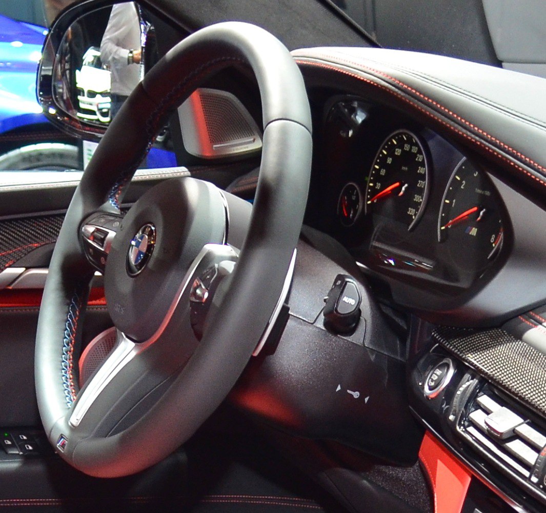 Sporty steering wheel and detailed dashboard with instrumentation cluster