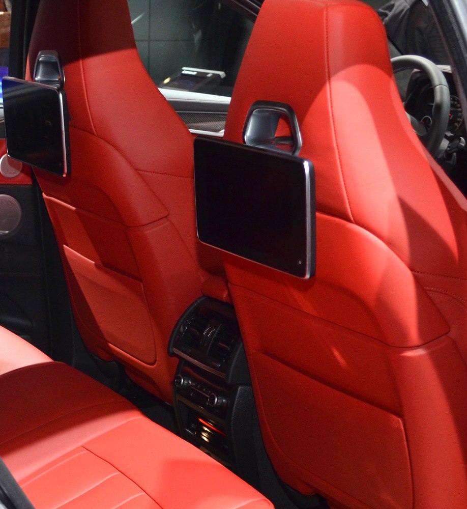 Rear seat entertainment screens and red leather interior upholstery