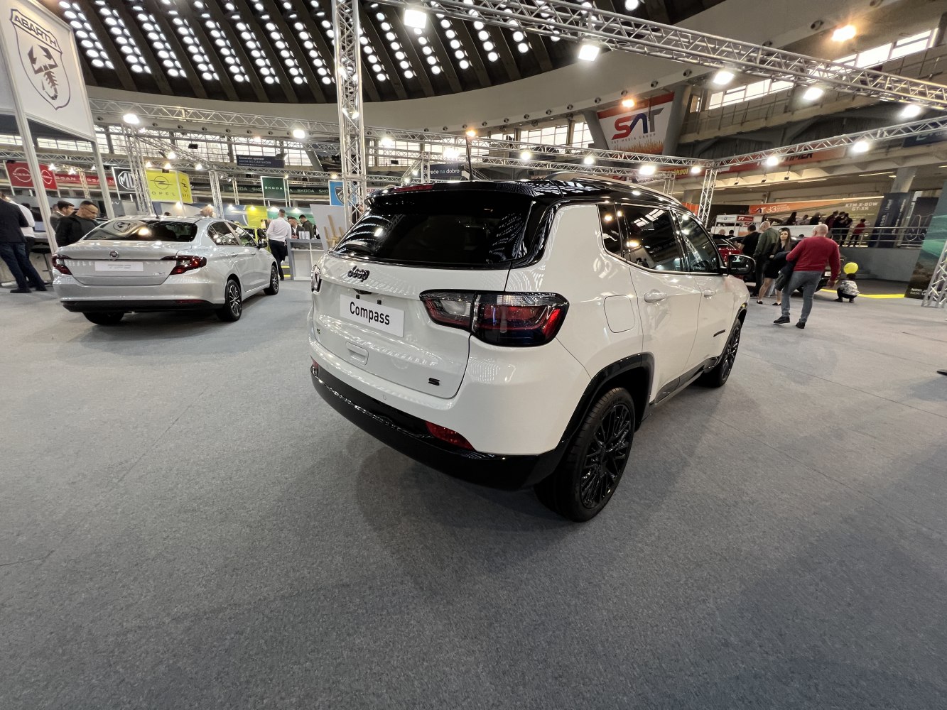 Rear and side view of SUV with black roof and distinctive taillights