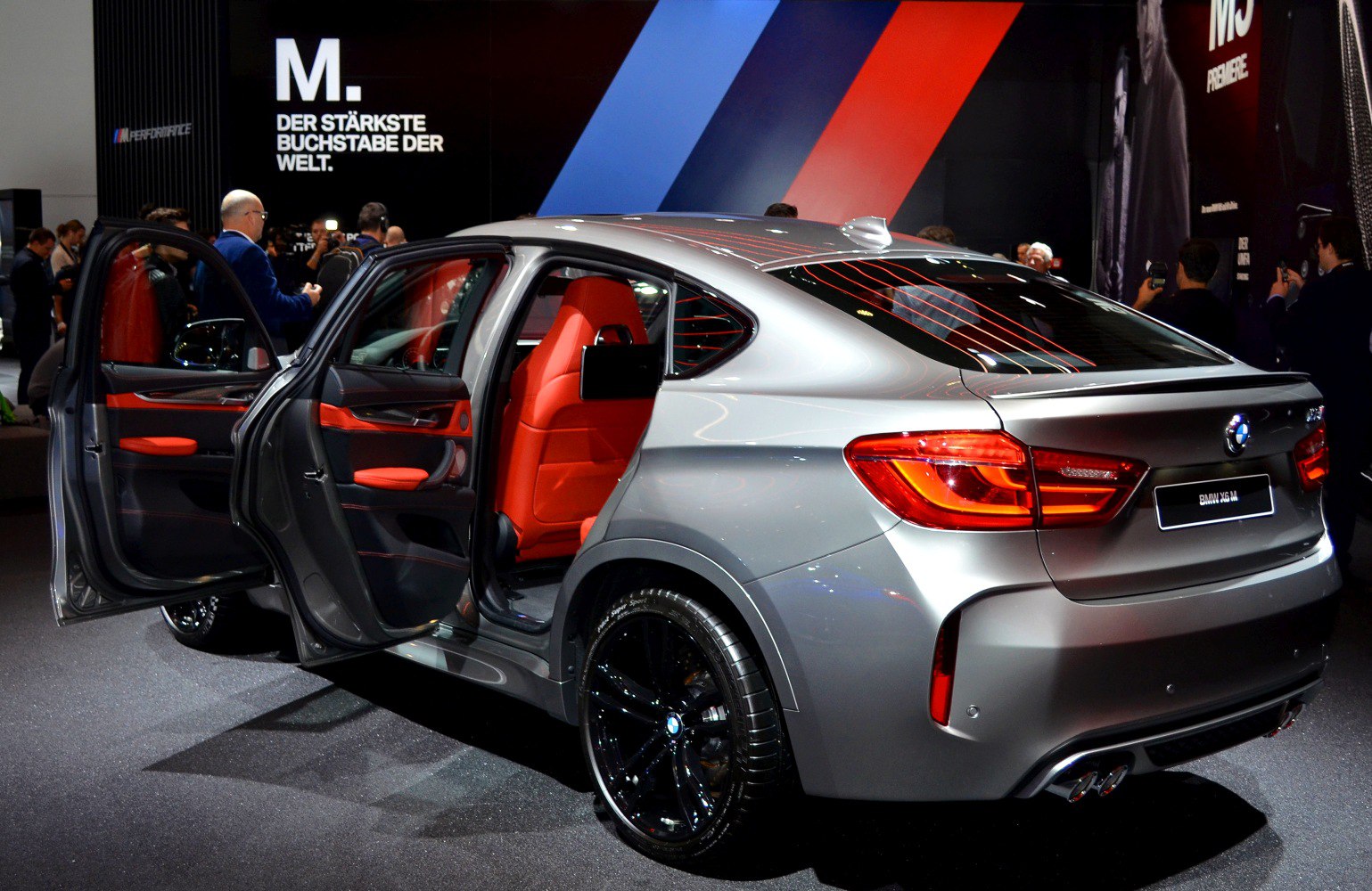 Silver SUV with red interior and open rear doors