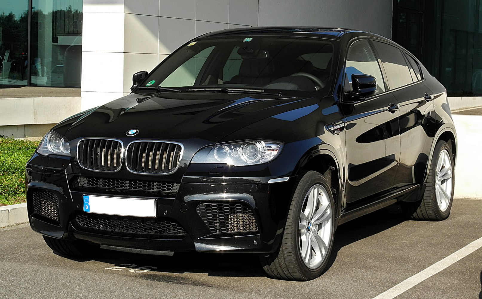 Black BMW front view, kidney grille, LED headlights, sporty bumper