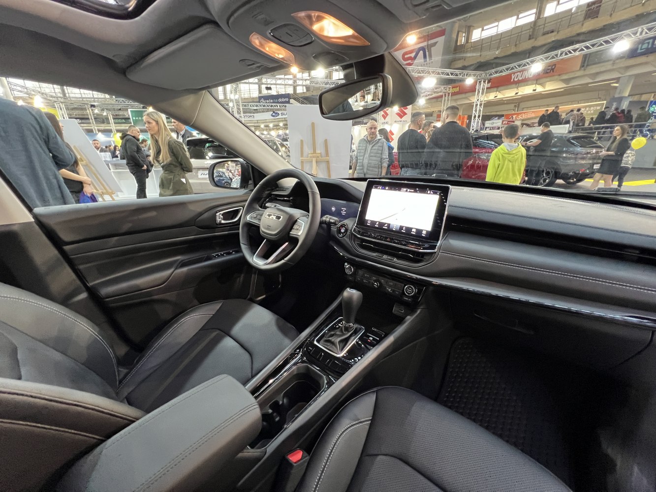 Digital dashboard and touchscreen infotainment system inside car cabin