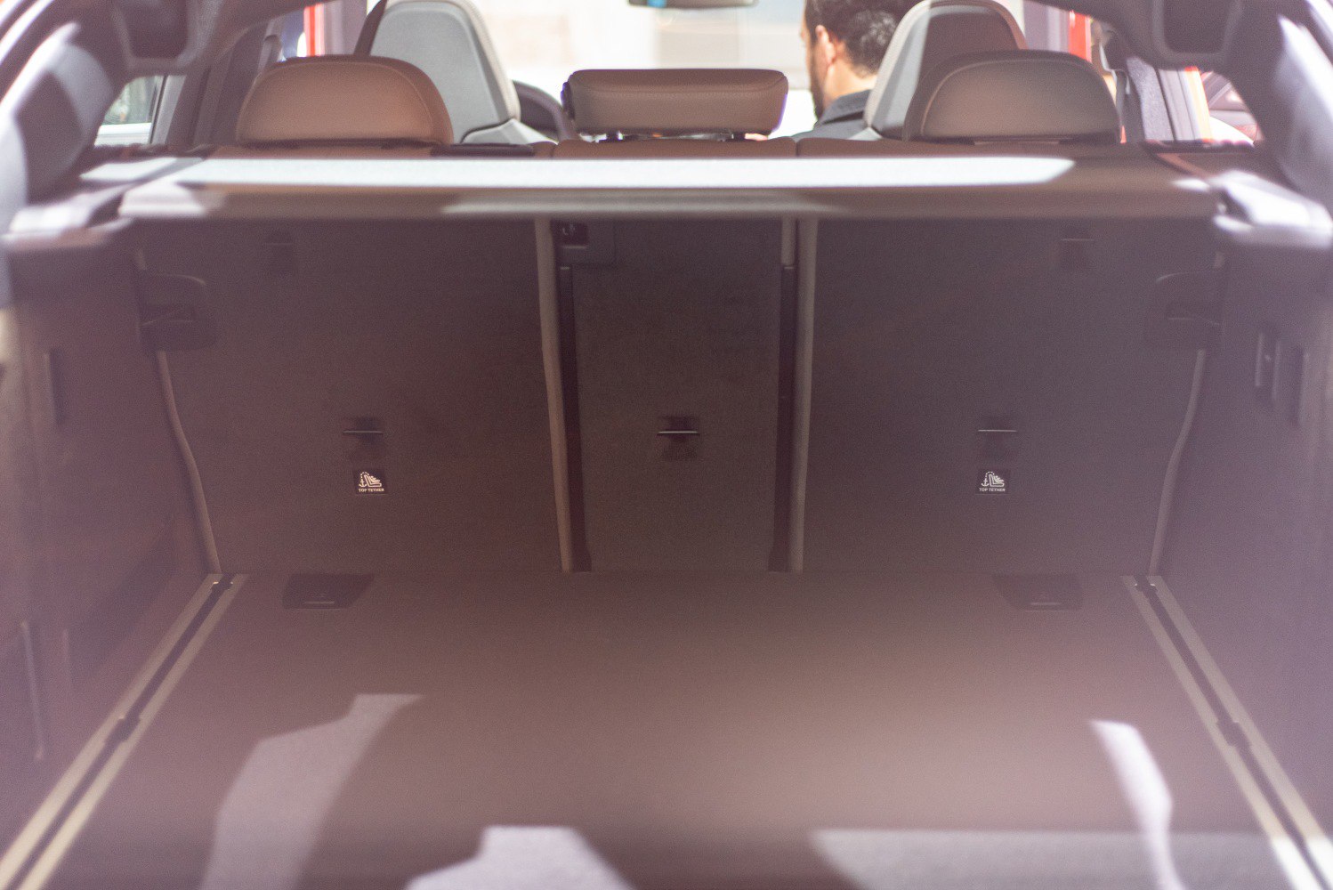 Spacious rear cargo area with visible seatbacks and headrests