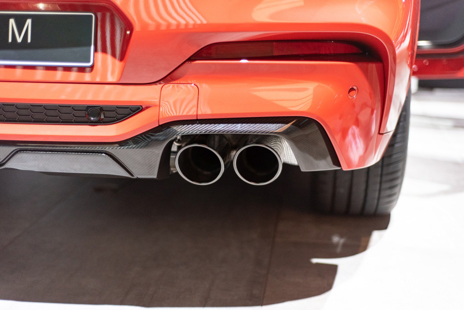 Dual chrome exhaust tips with carbon fiber rear diffuser