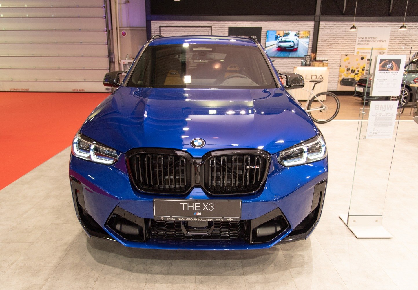 Front view with prominent kidney grille and LED headlights in blue color
