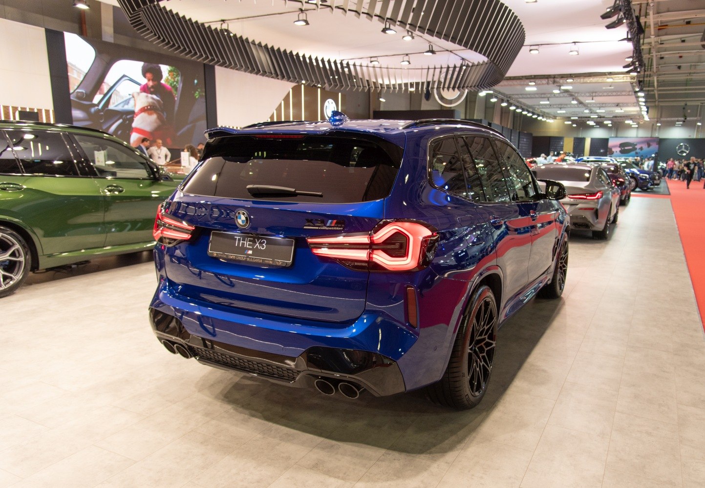 Rear view of sporty SUV with LED taillights and quad exhaust pipes