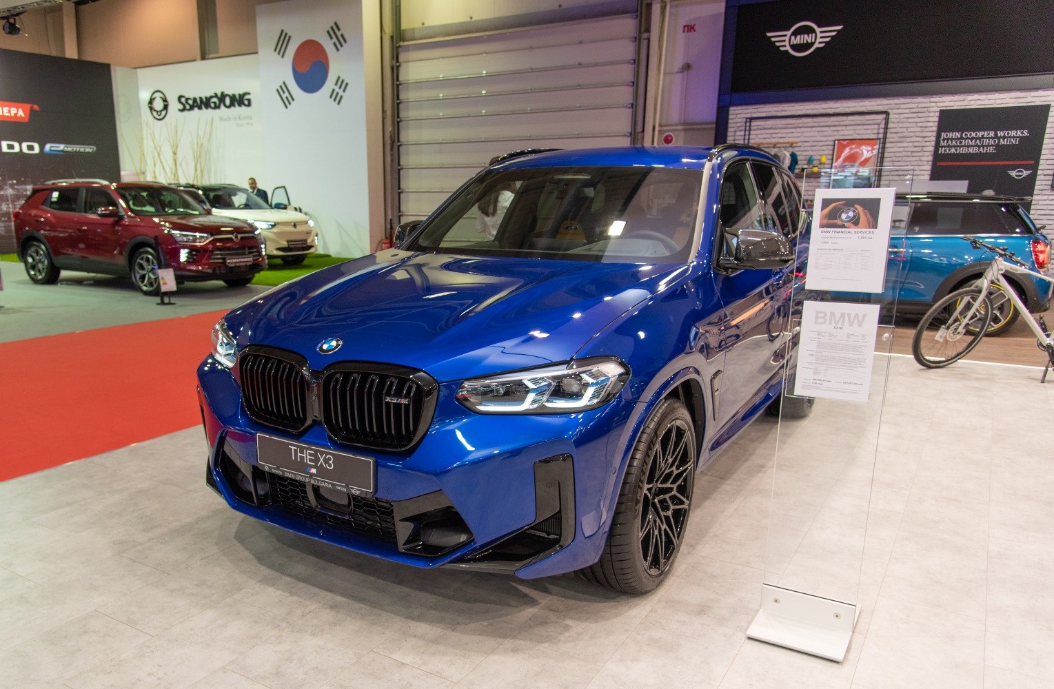 Blue BMW X3 M front with black kidney grille and sporty headlights