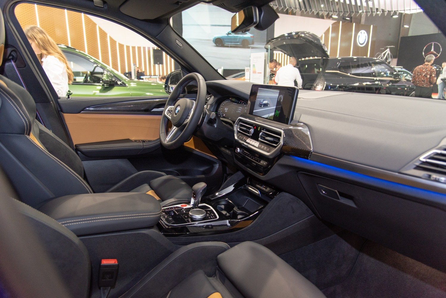 Modern BMW SUV interior with digital dashboard and infotainment screen