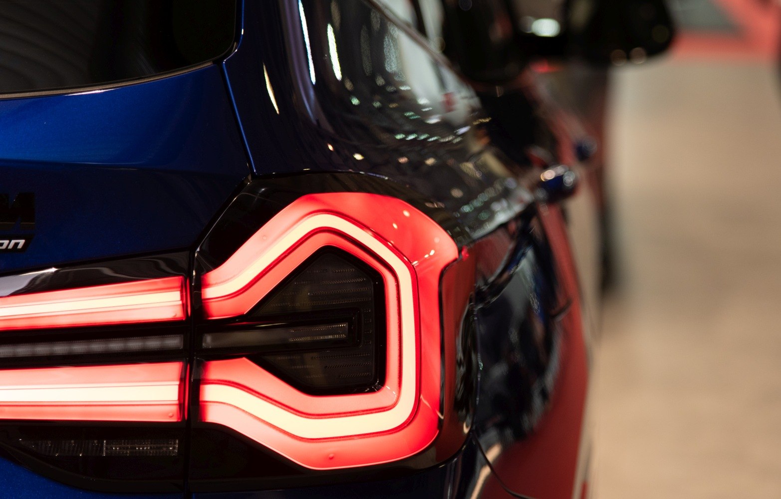 Close-up of angular LED tail light on blue rear panel