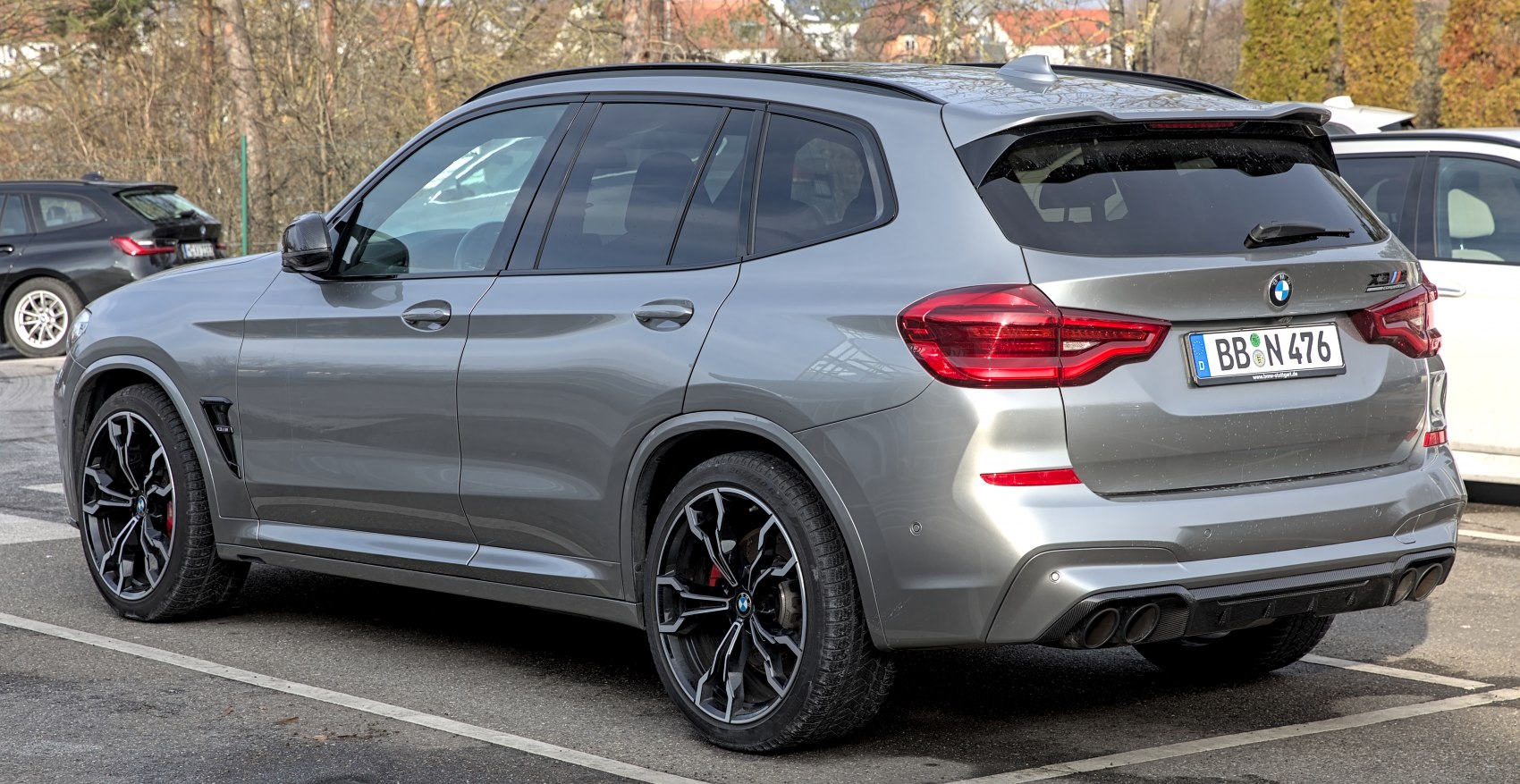 Rear side view with distinct taillights and sporty alloy wheels