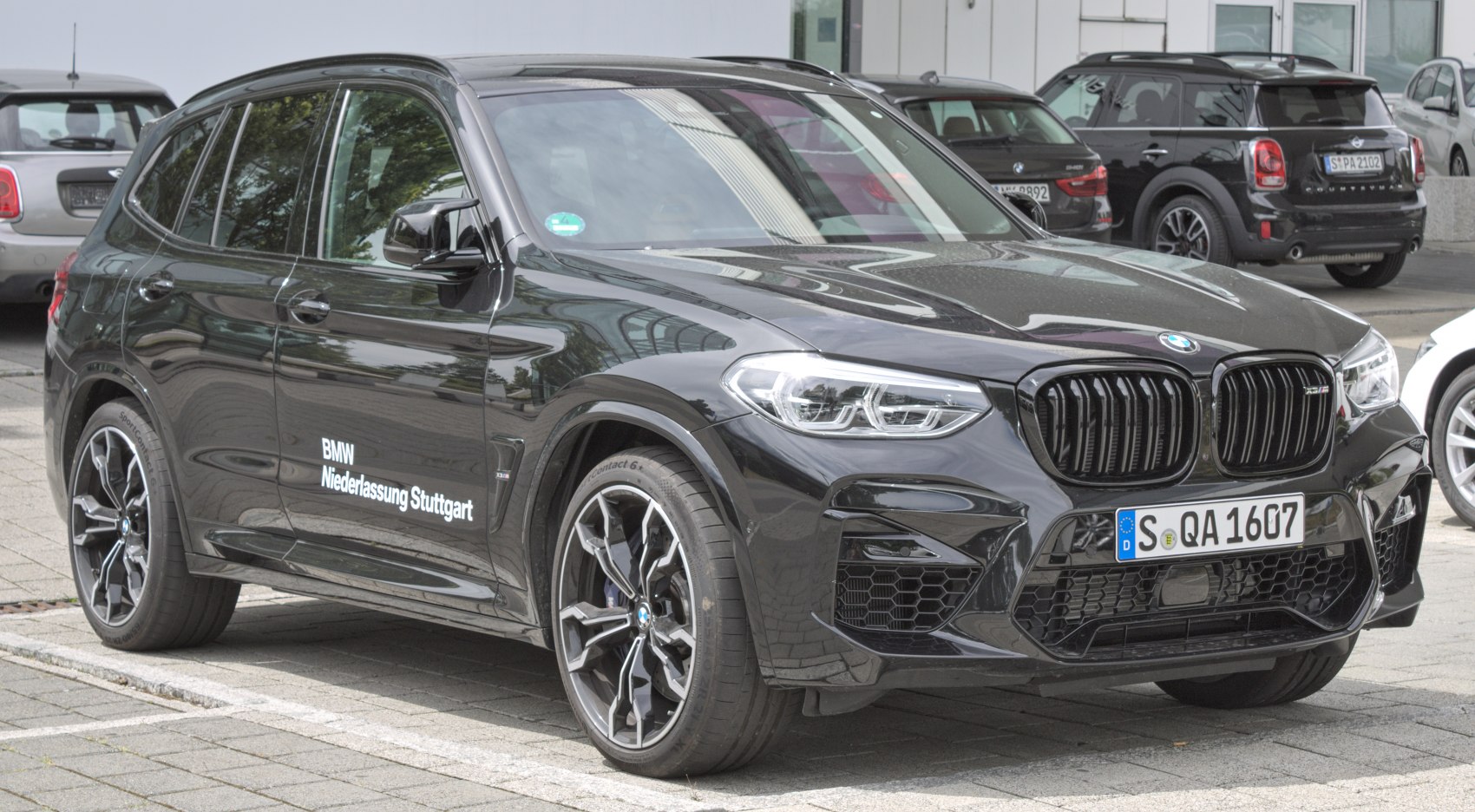 Aggressive front grille and sporty alloy wheels on performance SUV