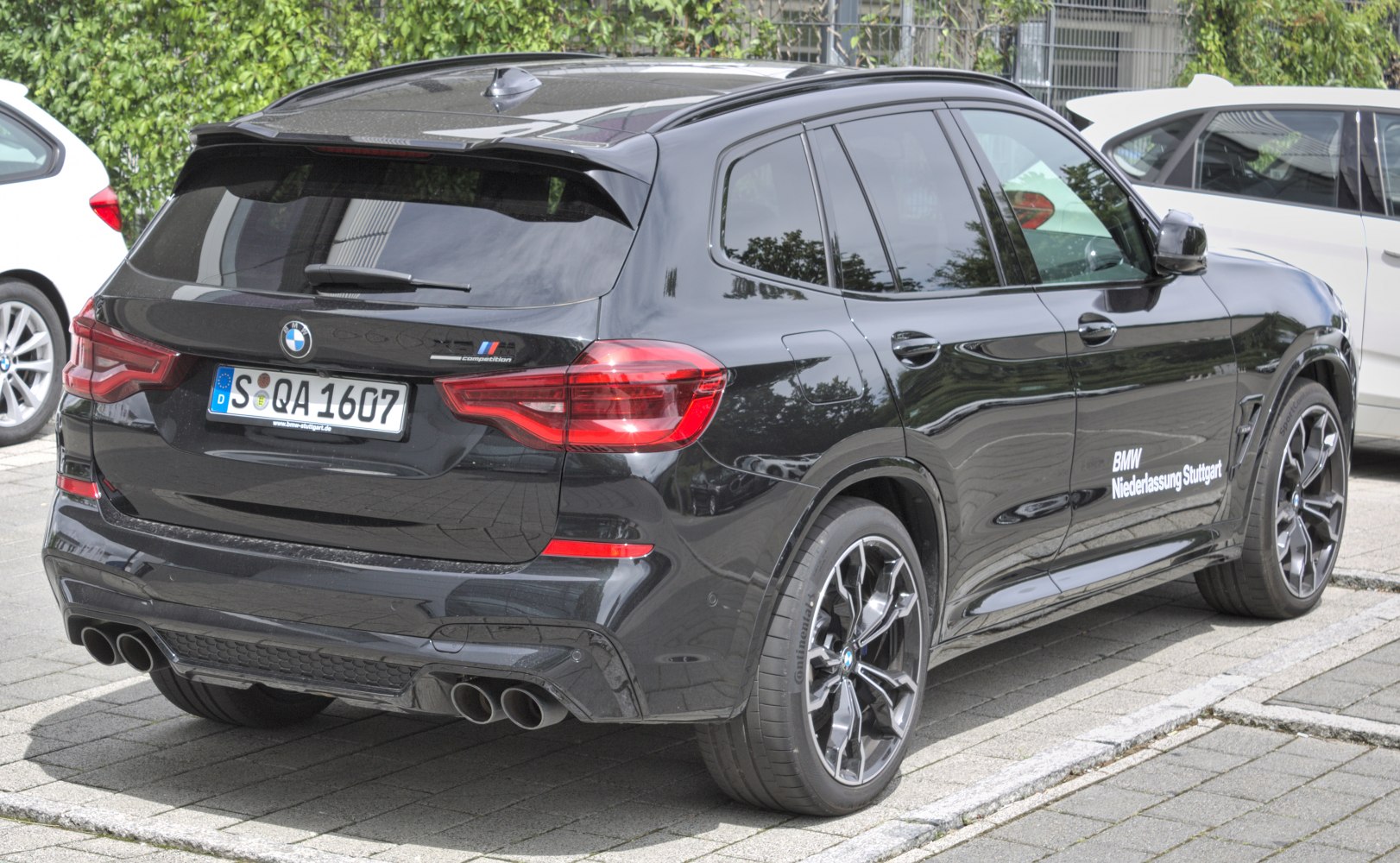Rear view with quad exhaust and sporty black alloy wheels