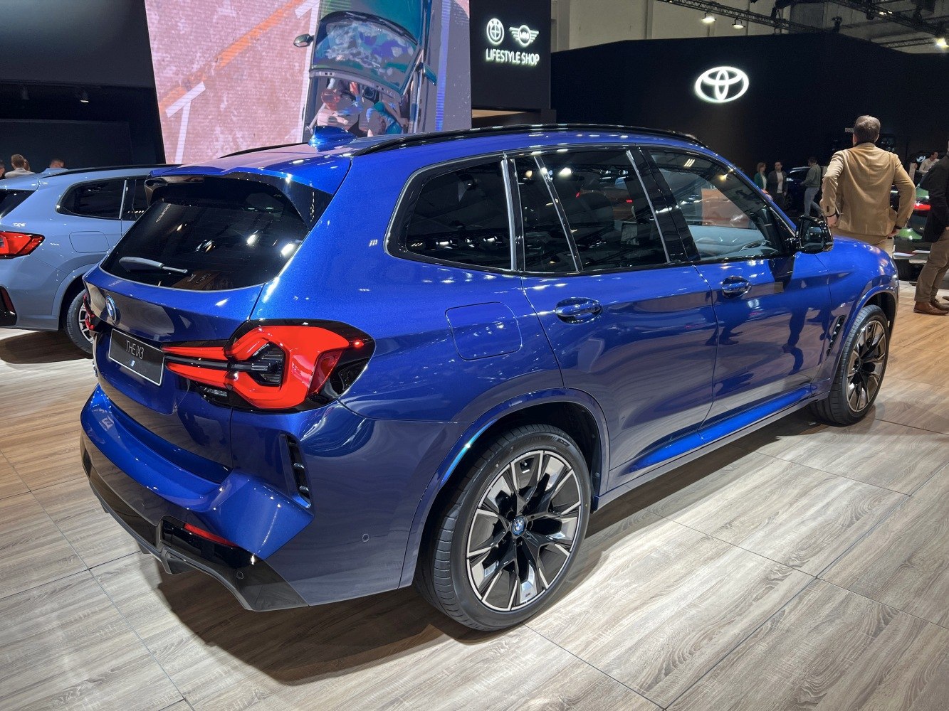 Electric SUV rear with distinctive tail lights and alloy wheels